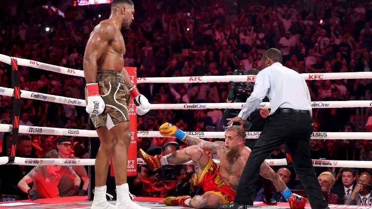Two-time world heavyweight champion Anthony Joshua made a statement in Miami, defeating social media star Jake Paul with a powerful sixth-round knockout. Despite Paul's attempts to evade and clinch early on, "AJ" eventually found his rhythm and a "scintillating straight right hand" that put Paul down for good. 